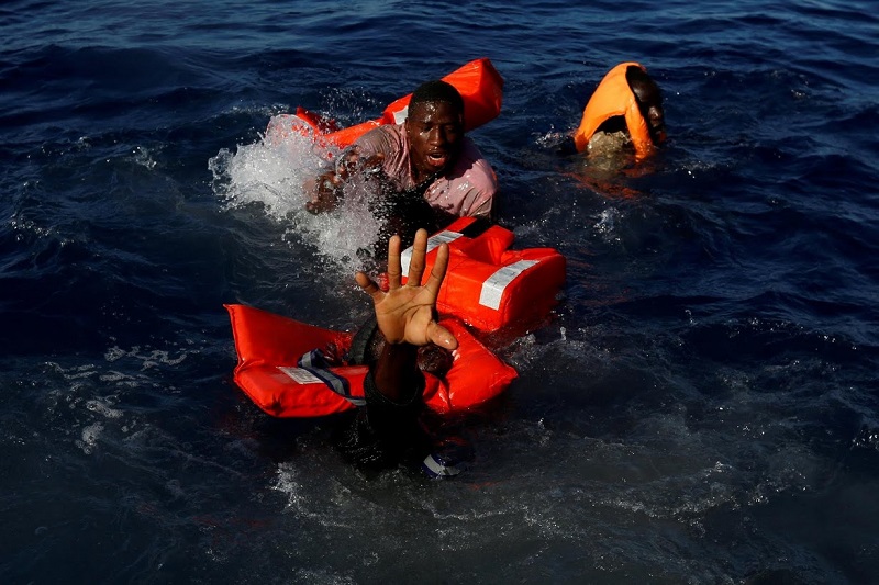 <div>
	Darrin Zammit Lupi: "I spent five weeks with the Migrant Offshore Aid Station (MOAS) on their ship, Phoenix, covering search and rescue operations in the Mediterranean.</div>
<div>
	At the start of the Easter weekend we were on a routine rescue around 15 nautical miles off the Libyan coast. I was on the MOAS fast rubber boat with crew members handing out life jackets to a group of 134 Sub-Saharan migrants on a flimsy dinghy before we would transfer them to the Phoenix.</div>
<div>
	I had one camera up to my eye to shoot some wide angle frames. Suddenly, one migrant balancing on the rim of a dinghy slipped sideways and like dominos several of his colleagues lost their balance and fell into the sea.</div>
<div>
	I captured the whole sequence by keeping my finger on the shutter button. It was chaos. I kept shooting as the rescuers leapt into action, helping several of the migrants pull themselves onto our boat.</div>
<div>
	I was grabbing hold of people with one hand and shooting with the other. Then, through my viewfinder, a few metres away, I noticed one man struggling more than the others, stretching out his arm towards us.</div>
<div>
	I screamed to alert our specialist rescue swimmer that one man was going under. He reacted instantly, jumped in, and pulled the man to safety.</div>
<div>
	Afterwards, I did a lot of soul searching. Should I have put down my cameras altogether and just grabbed hold of whoever I could?</div>
<div>
	That evening I discussed it with the rescuers, who felt I'd done the right thing. Their job was to rescue lives. Mine was to document the harsh reality of what's happening. Everyone survived that day."</div>